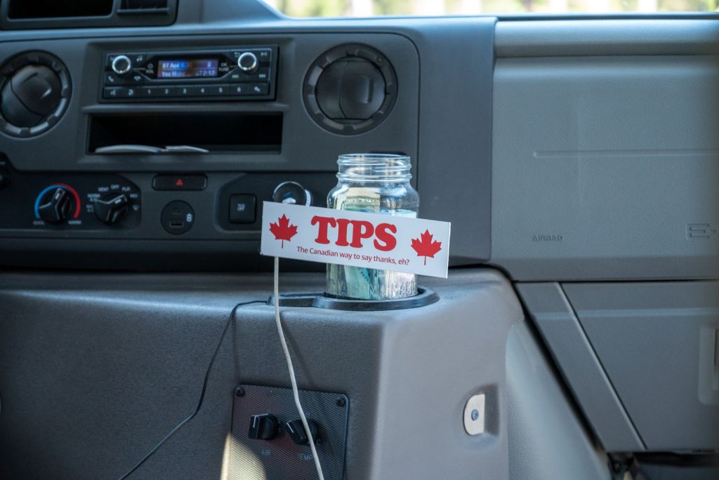 inside a vehicle with tip jar for gratuities